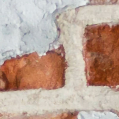 zoomed-view-of-red-brick-wall-with-earth-plaster-murals